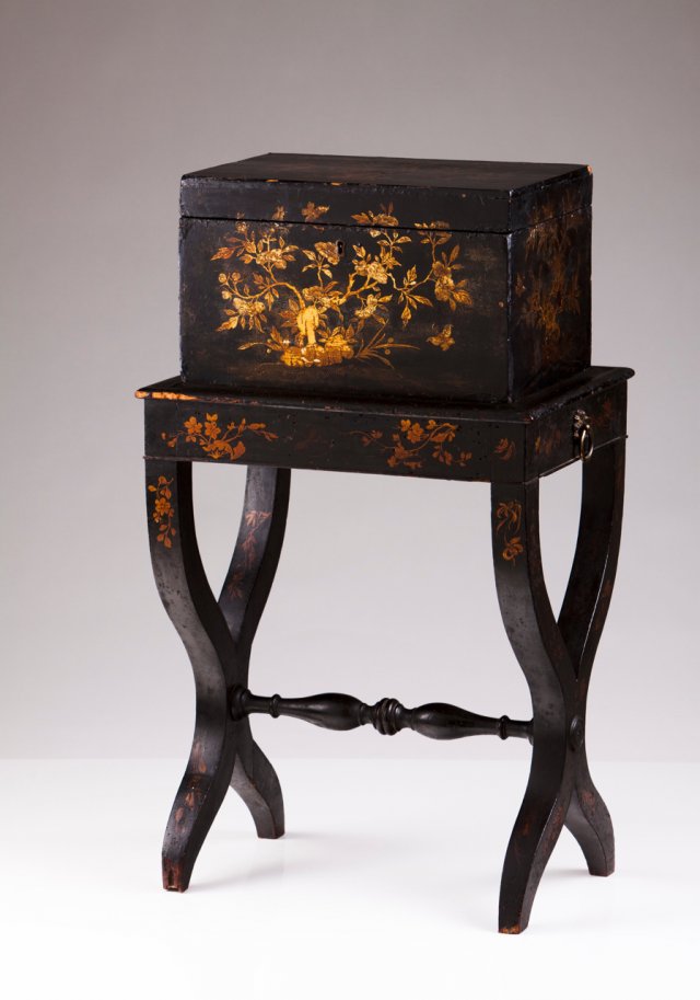 A tea caddy with stand