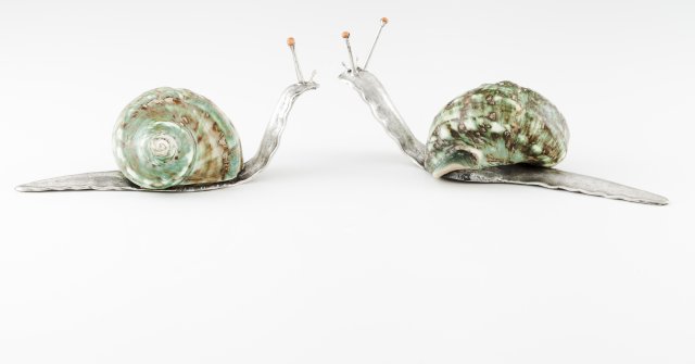 A pair of Luiz Ferreira snail sculptures
